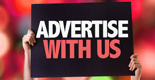 A person holding a sign that says 'Advertise With Us' against a colorful, blurred background.